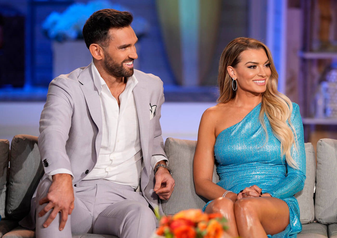 Carl Radke and Lindsay Hubbard sit on the couch during the 'Summer House' reunion 