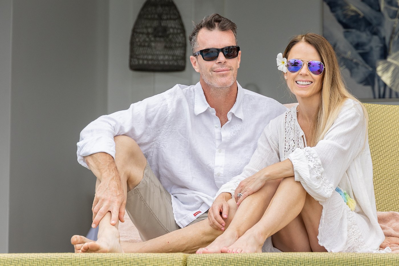 'The Bachelorette' Trista Sutter and Ryan Sutter relax on a lounger and smile 