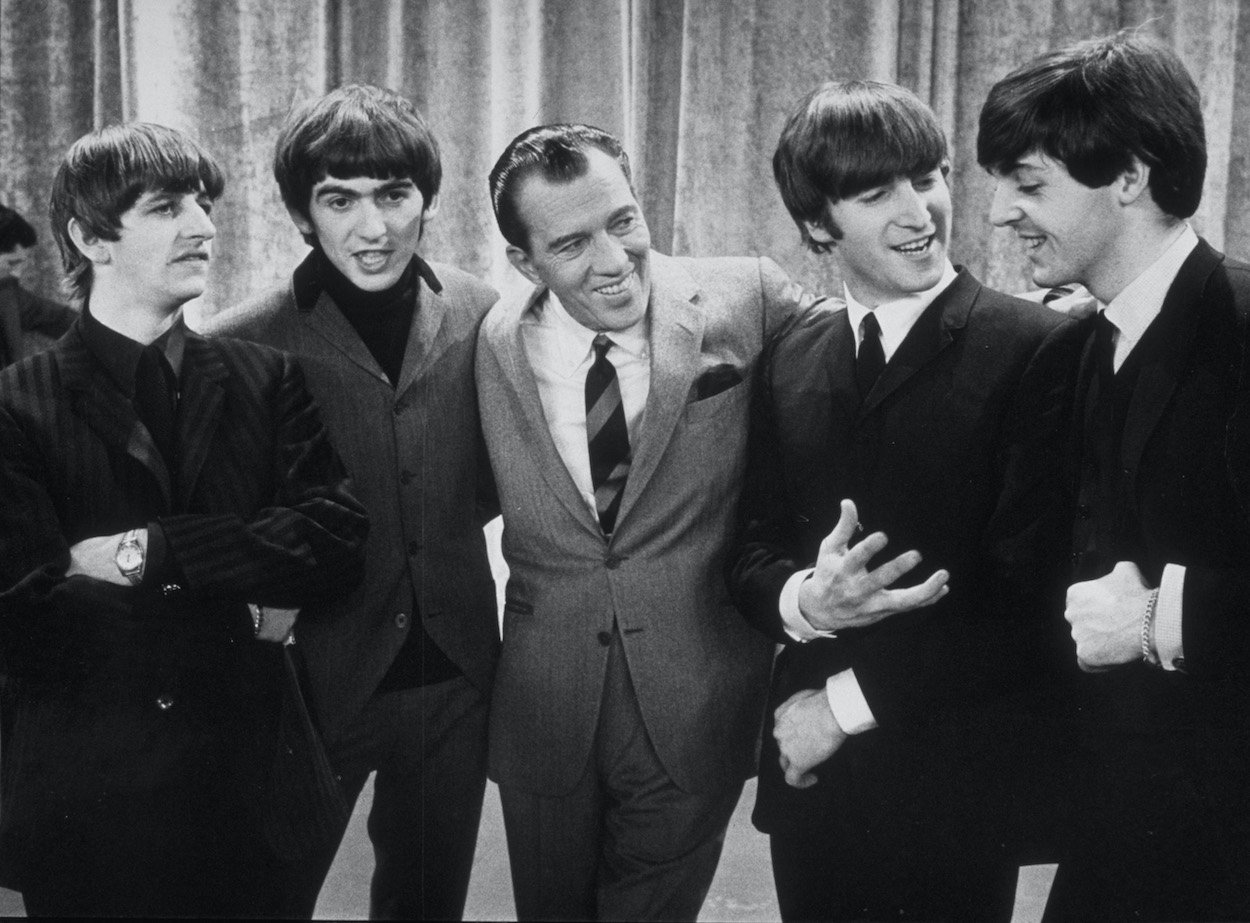 Ringo Starr (from left), George Harrison, Ed Sullivan, John Lennon, and Paul McCartney chat during The Beatles appearance on Sullivan's show on Feb. 9, 1964.