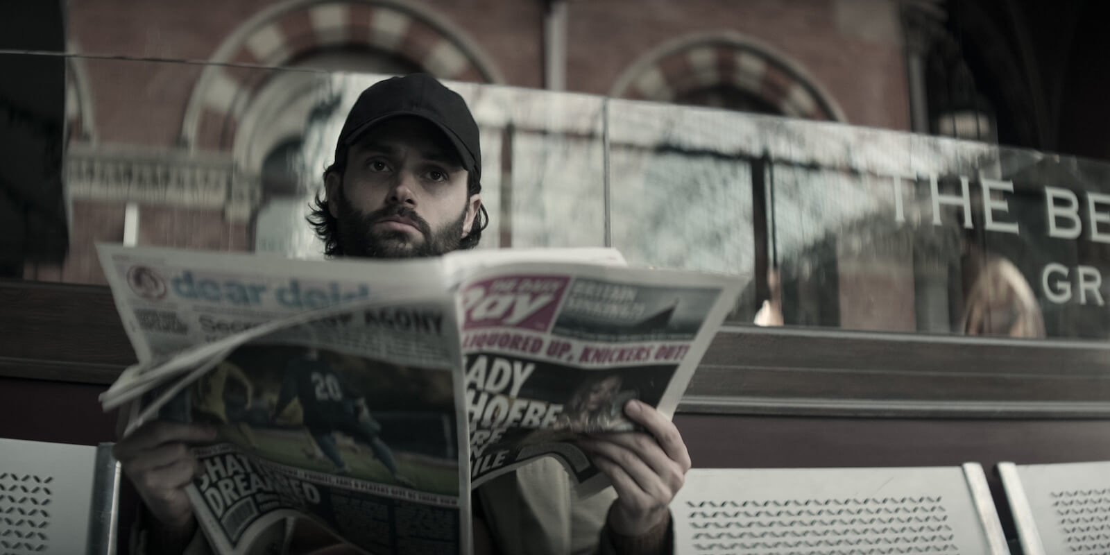 'You' Season 4: Joe (Penn Badgley) reads a newspaper 