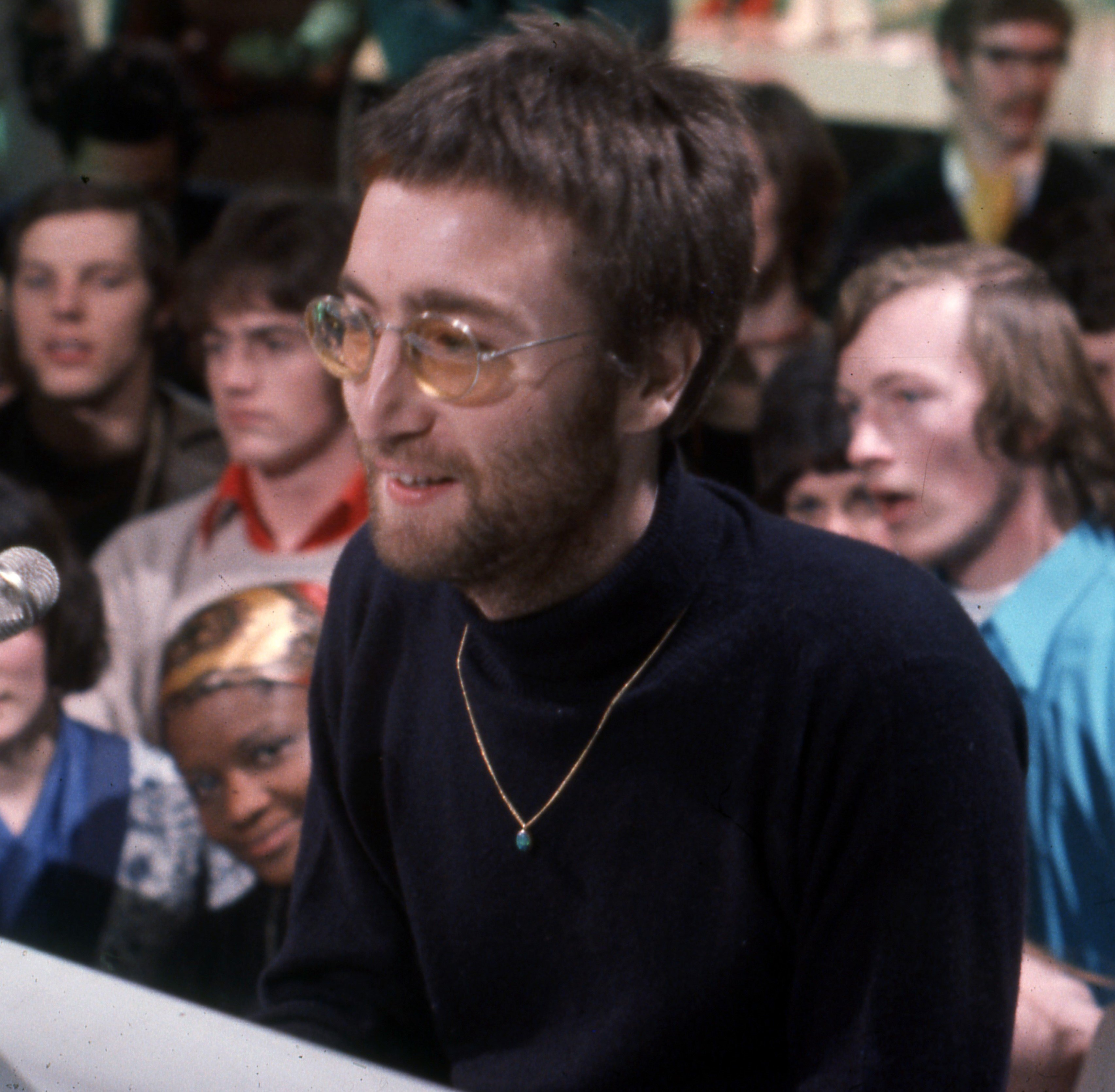 "Instant Karma!" singer John Lennon wearing black