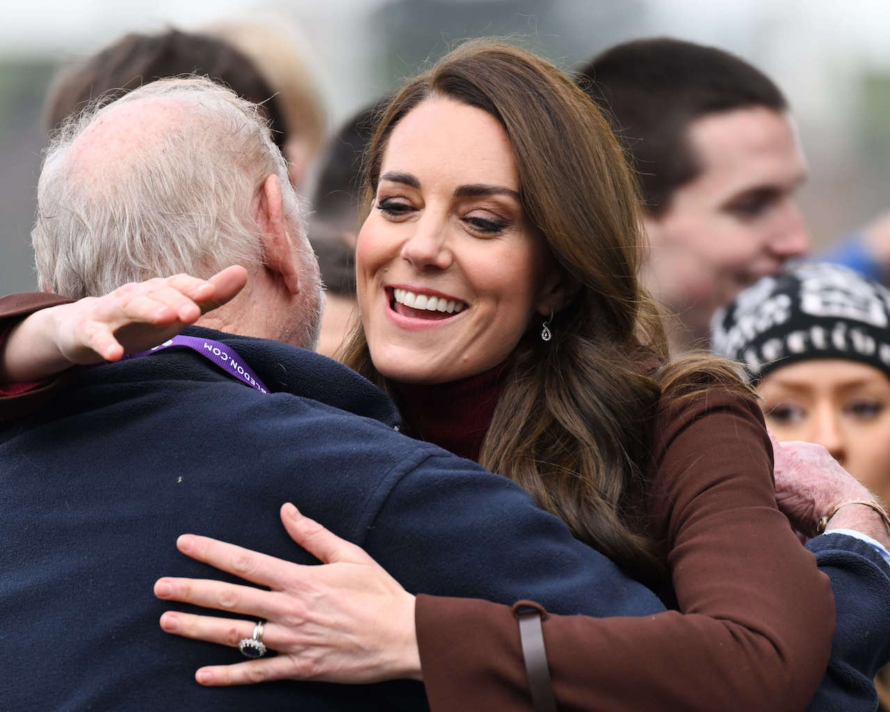 Kate Middleton, Princess of Wales, breaks the mold and hugs her former school teacher Jim Embury during a visit to the National Maritime Museum Cornwall with Prince William, Prince of Wales on February 09, 2023, in Falmouth, England. 