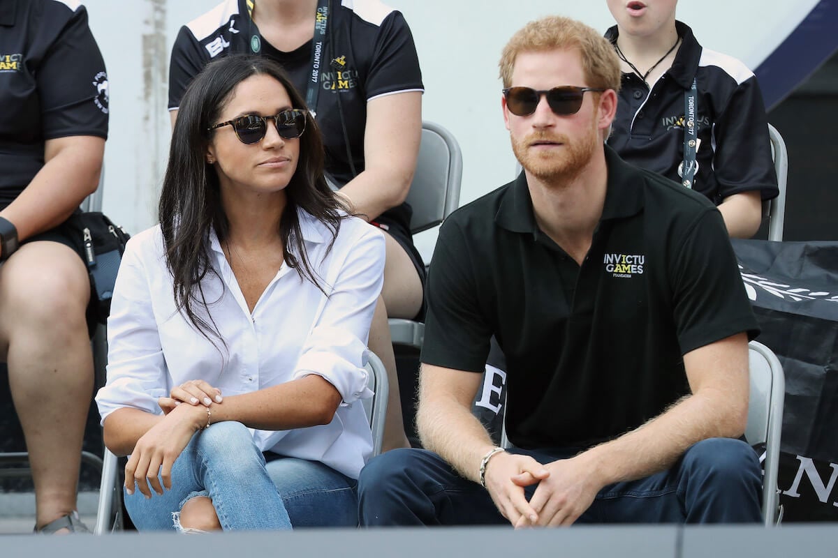 Meghan Markle and Prince Harry, who wrote in 'Spare' that a statement from 'the Palace' in 'defense of Meg' might've 'made a world of difference', attend the 2017 Invictus Games