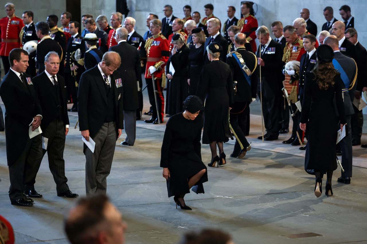 Prince Harry and Meghan Markle pay their respects inside Westminster Hall at the Palace of Westminster, where the coffin of Queen Elizabeth II laid in state.