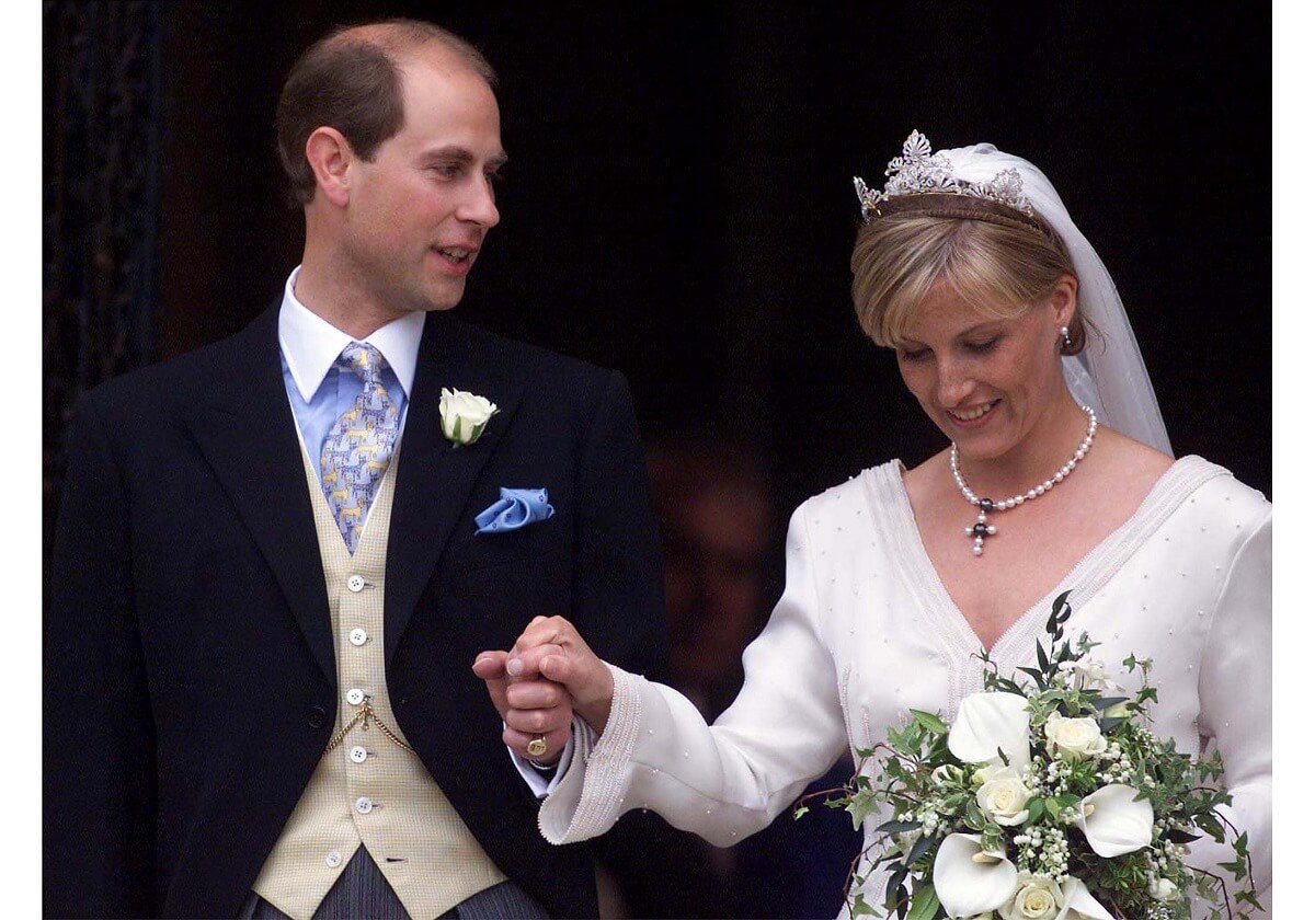 Prince Edward and his bride Sophie hold hands after their wedding at St. Georges Chapel in Windsor