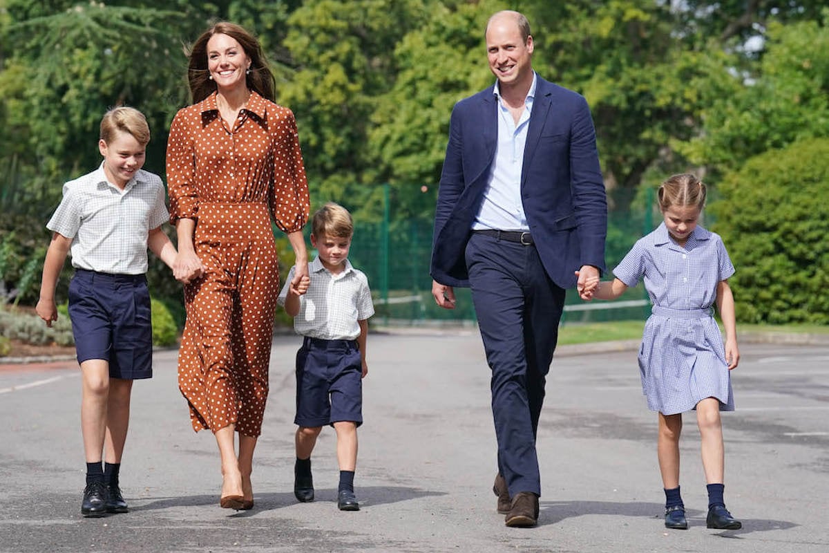 Princess Charlotte, whom a royal authors says is like Princess Anne, walks with Prince George, Kate Middleton, Prince Louis, and Prince William