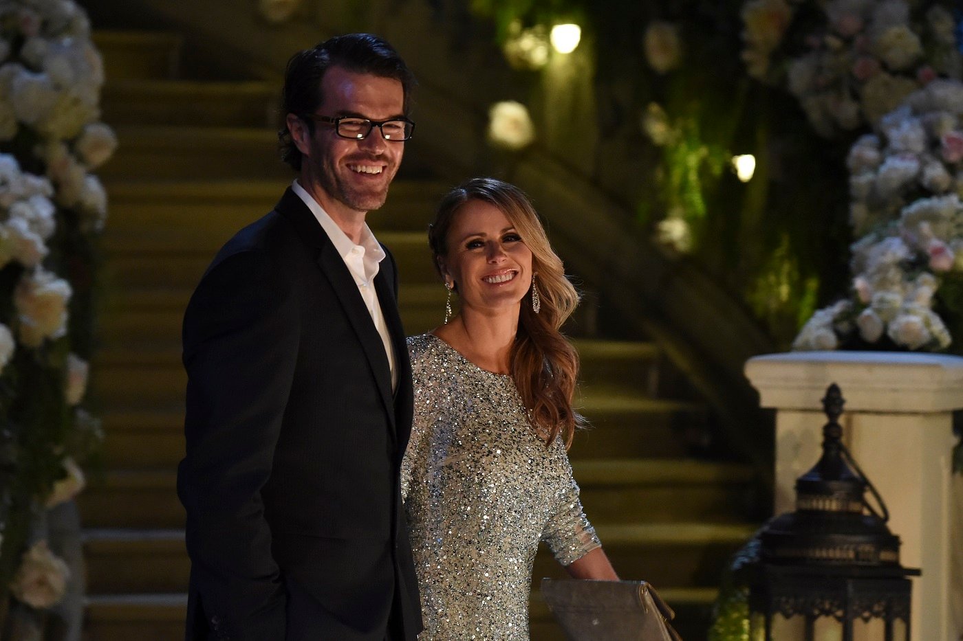 Ryan Sutter and Trista Sutter of 'The Bachelorette' walk side by side and smile at the camera