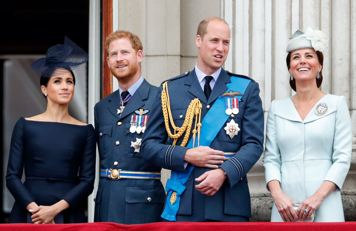 Meghan Markle and Prince Harry stand with Prince William and Kate Middleton