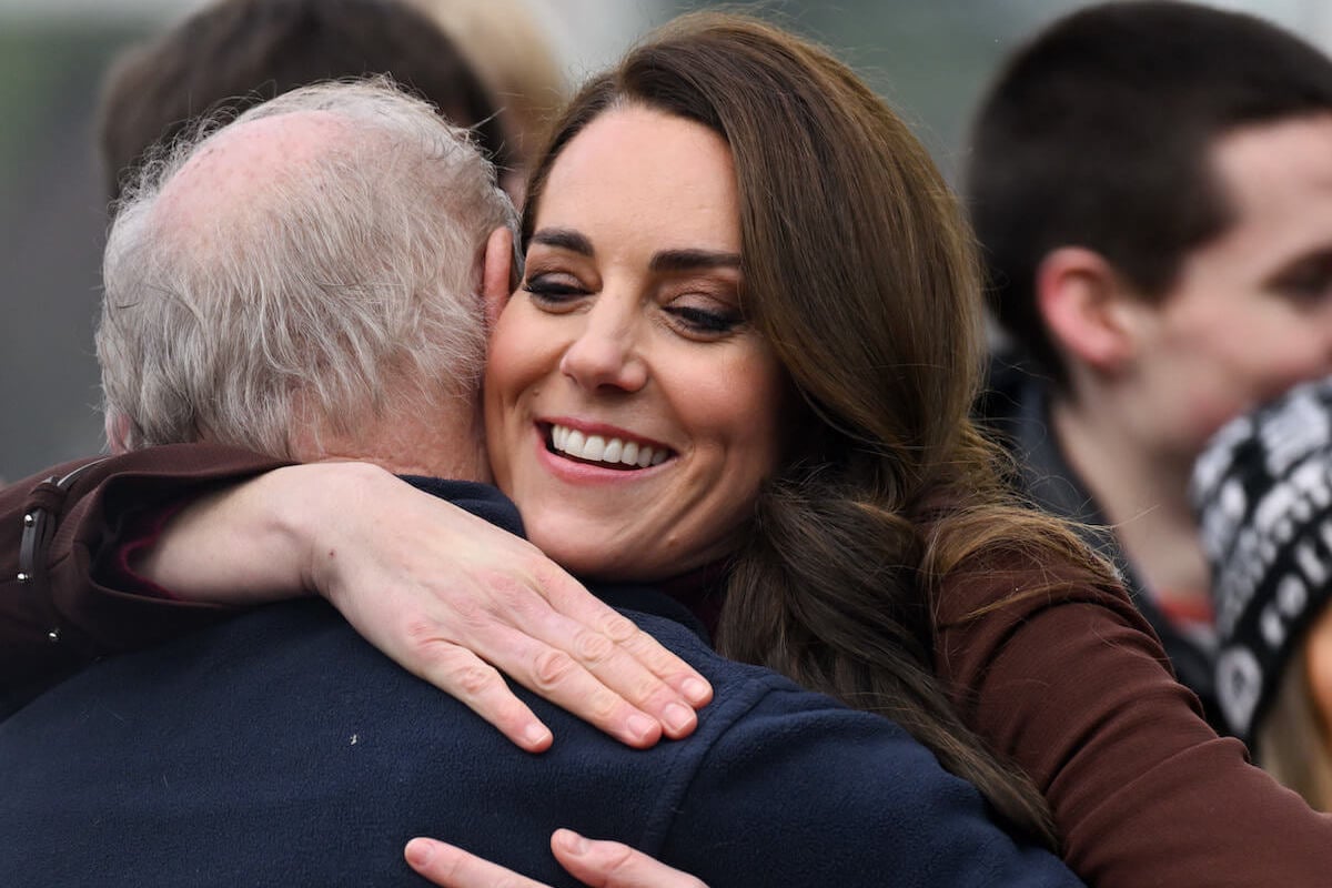 Kate Middleton, who has a reportedly increased 'hug rate,' hugs her former teacher