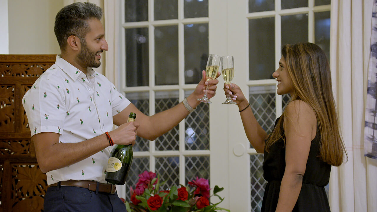 Abhishek "Shake" Chatterjee and Deepti Vempati toast with champagne on 'Love Is Blind' Season 2.