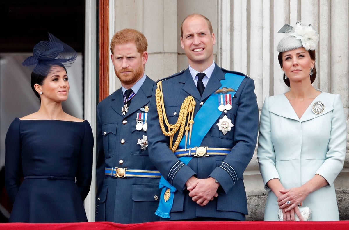 Meghan Markle, Prince Harry, Prince William, and Kate Middleton watch a flypast on the balcony of Buckingham Palace