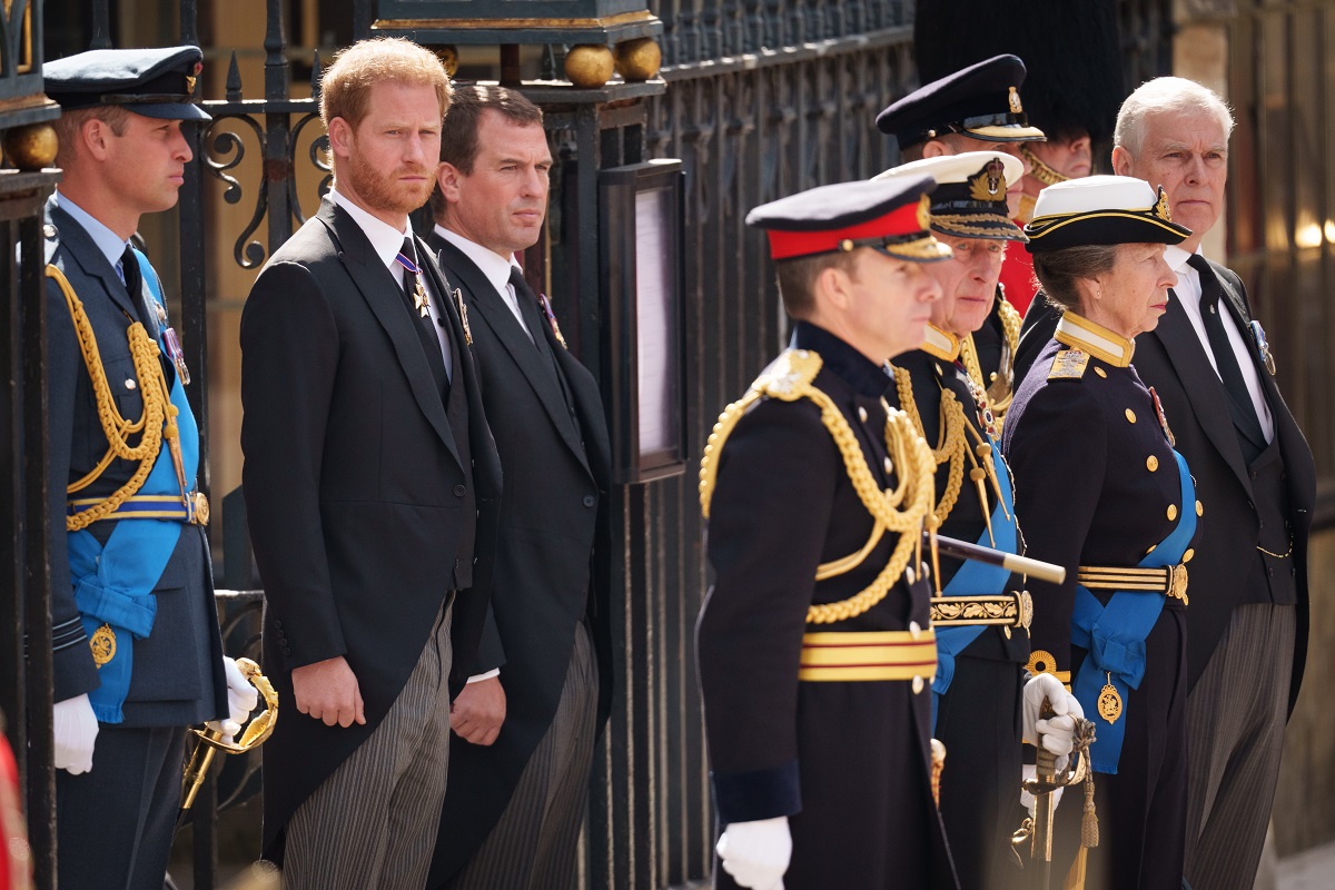 Prince Harry and other members of the royal family watch as Queen Elizabeth II's coffin departs from Westminster Abbey