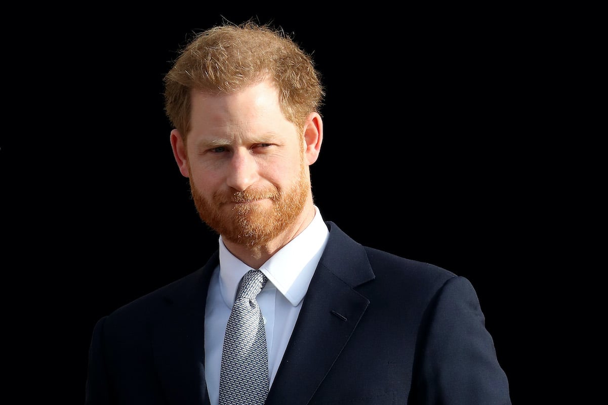 Prince Harry not smiling wearing a suit