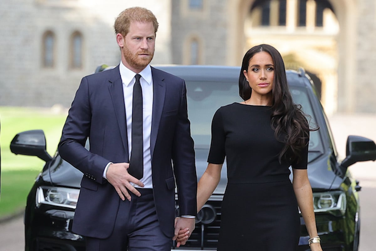 Prince Harry, who will be 'exposed' at the coronation, walks with Meghan Markle