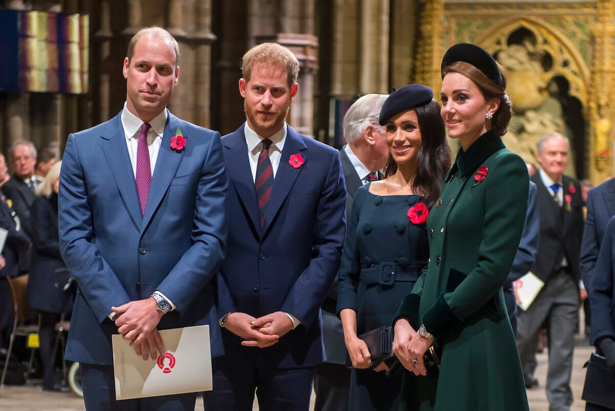 Prince William and Kate Middleton, who were 'apparently upset' they didn't receive Easter gifts from Prince Harry and Meghan Markle in 2018, stand with Prince Harry and Meghan Markle