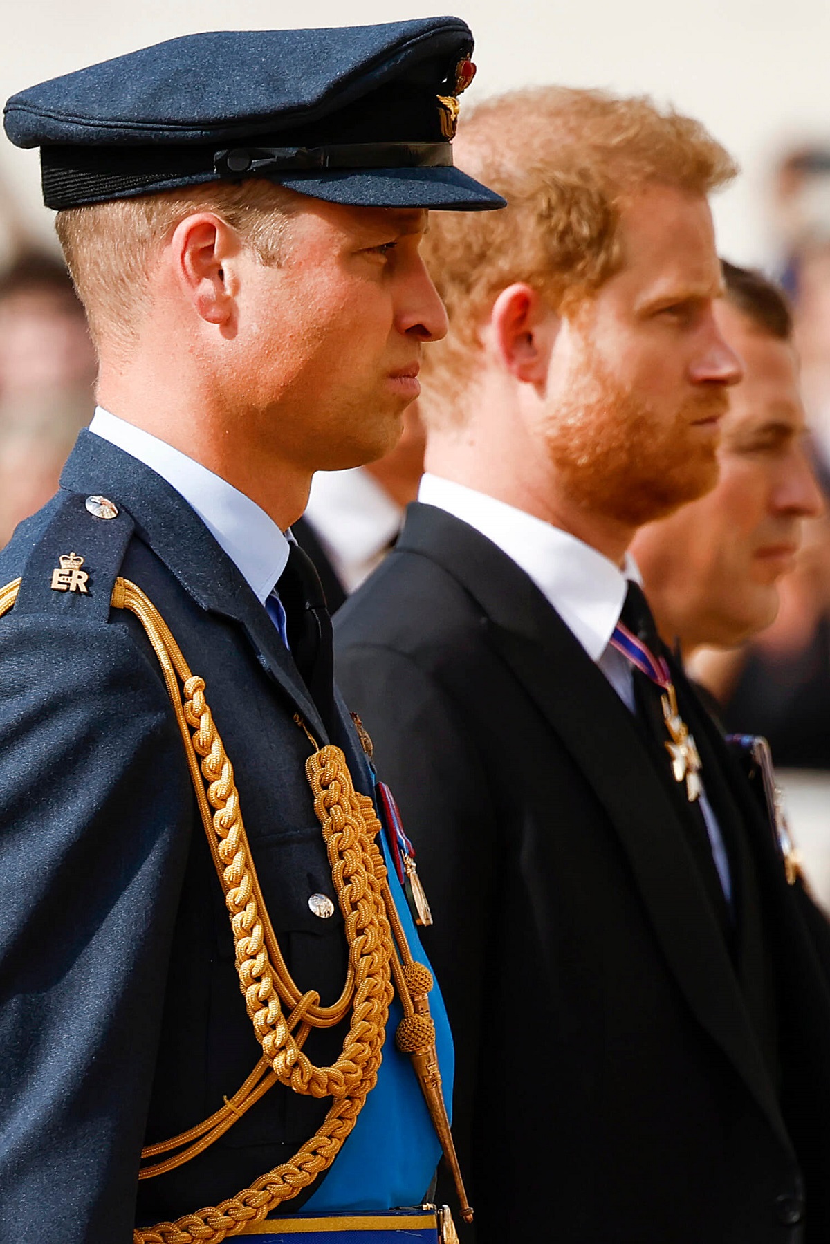 Prince William and Prince Harry walk behind Queen Elizabeth II's coffin during the procession for the Lying-in State