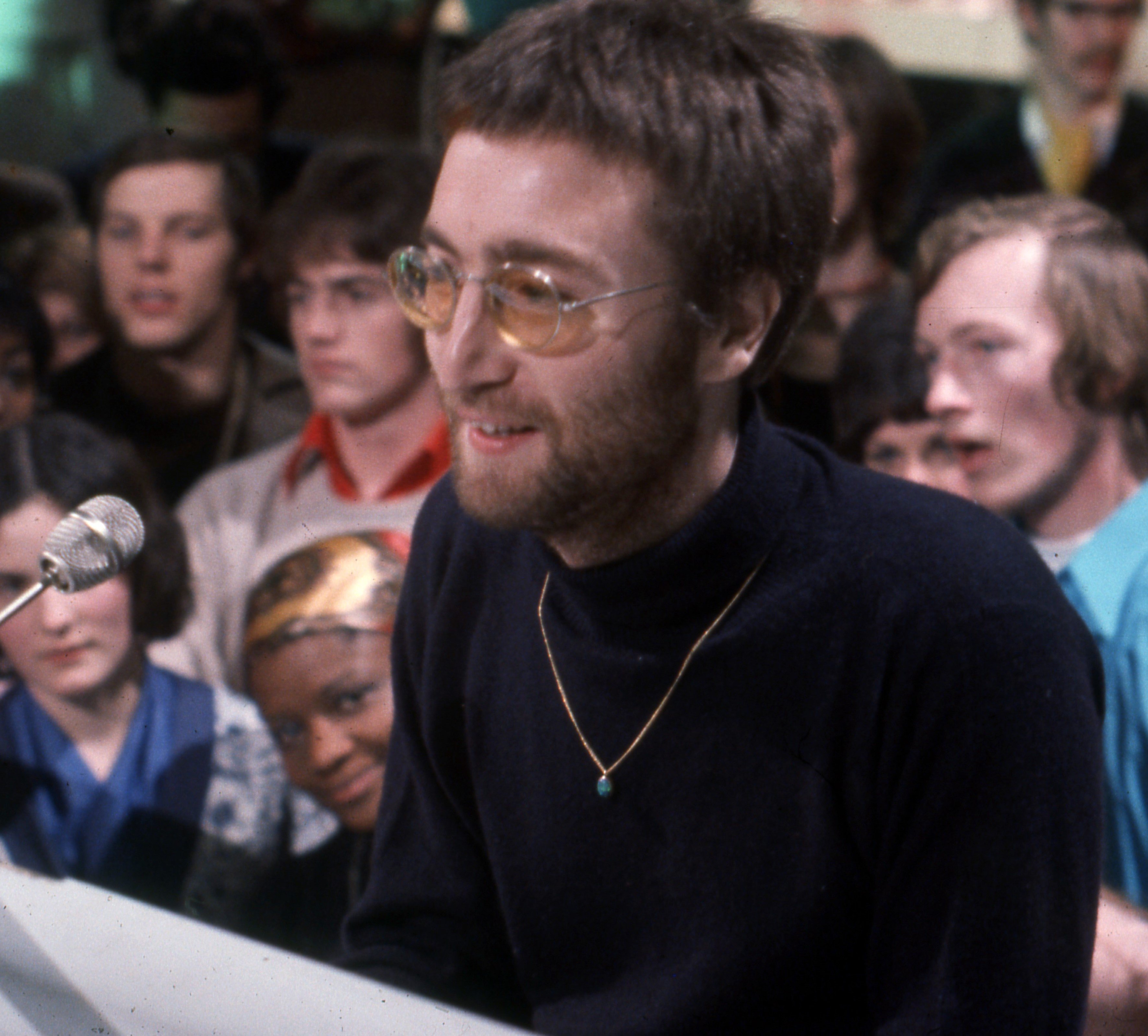 The Beatles' John Lennon at a piano