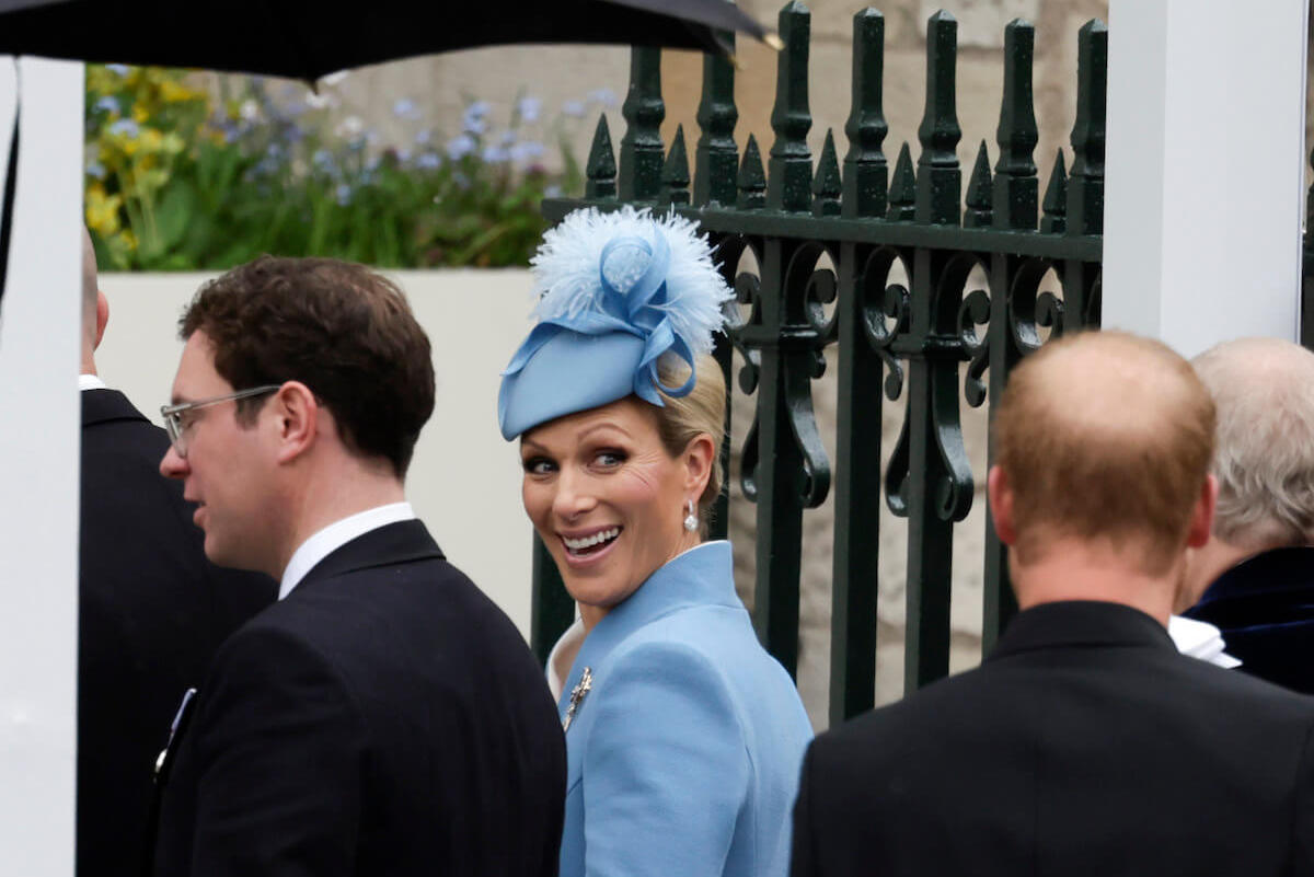 Jack Brooksbank and Zara Tindall, who appeared to be 'reigning herself in' with Prince Harry and Meghan Markle Platinum Jubilee weekend, arrives at the coronation in front of Prince Harry