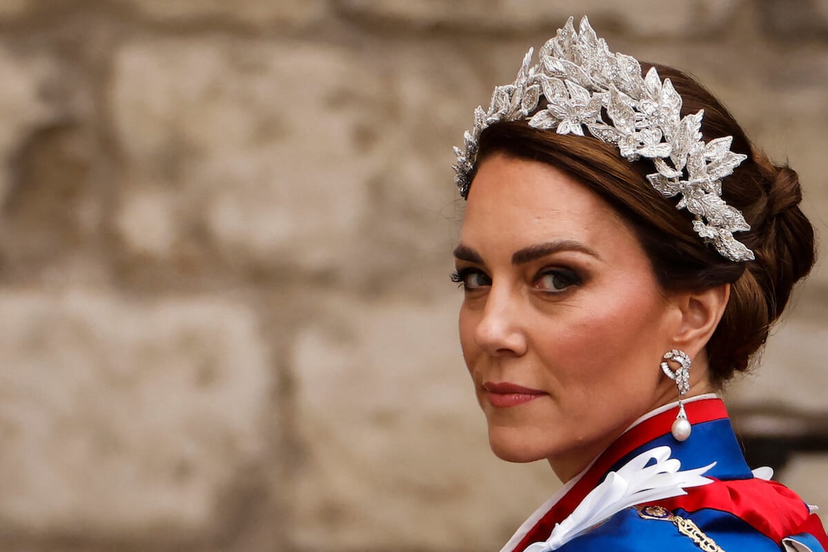 Kate Middleton, who showed her 'growing' power in the royal family with her family attending the coronation, looks on outside Westminster Abbey