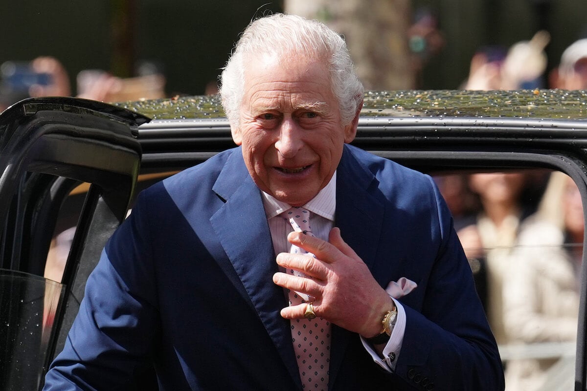 King Charles, who sat in the Coronation Chair at Westminster Abbey, looks on