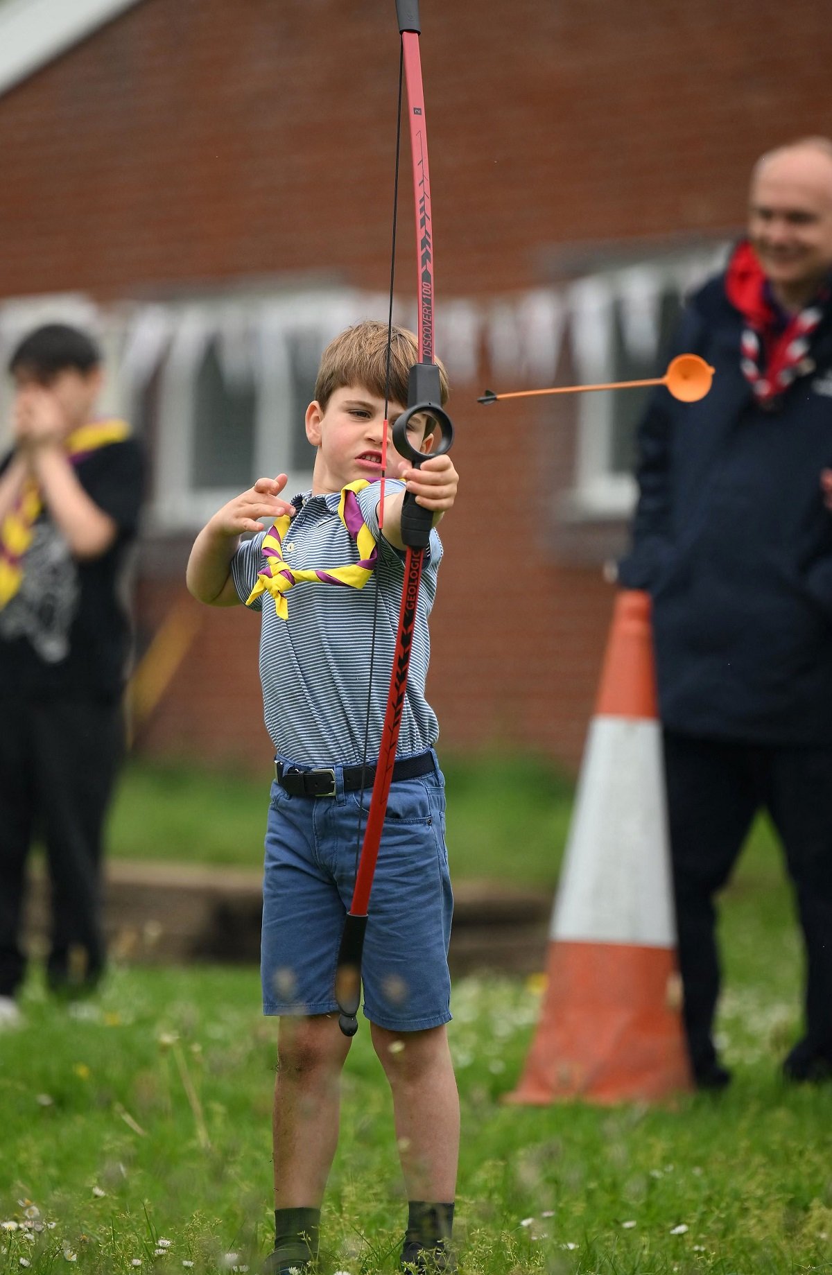 Prince Louis of Wales tries his hand at archery while taking part in the Big Help Out