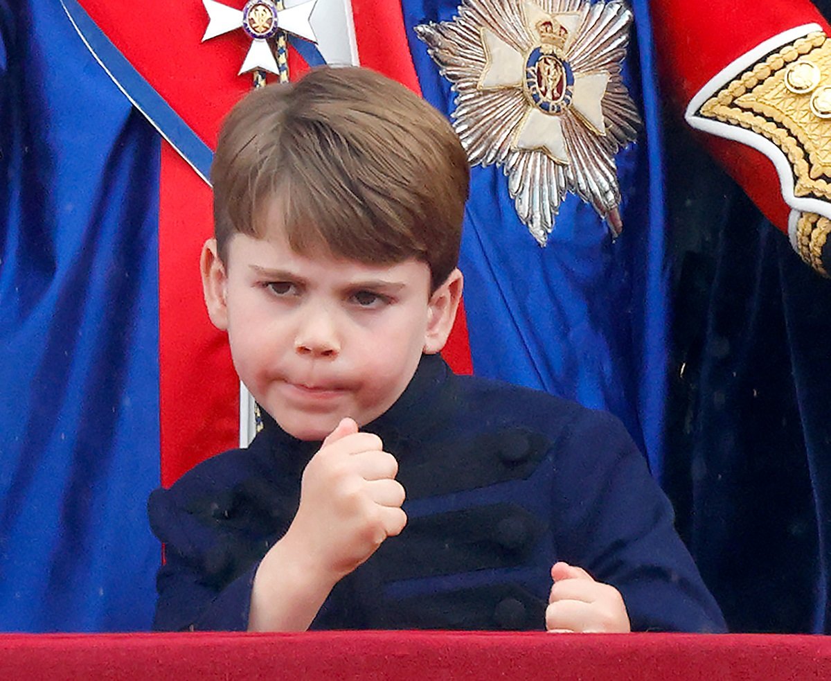Prince Louis watching a flypast from the balcony of Buckingham Palace following the coronation of King Charles III