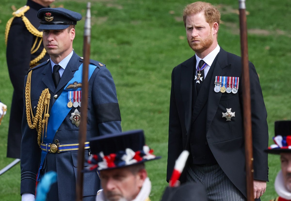 Prince William and Prince Harry, who a former royal butler thinks should reconcile at King Charles' coronation, watch as Queen Elizabeth II's coffin is transferred to a hearse for its journey to Windsor 