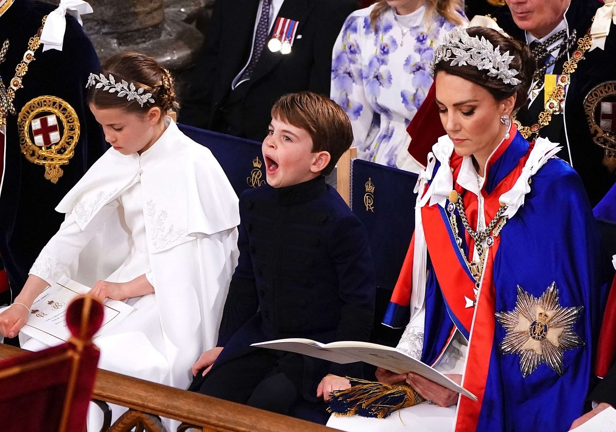 Princess Charlotte and Kate Middleton with Prince Louis, who a body language expert noticed was well-behaved, seated in the front row at King Charles' coronation