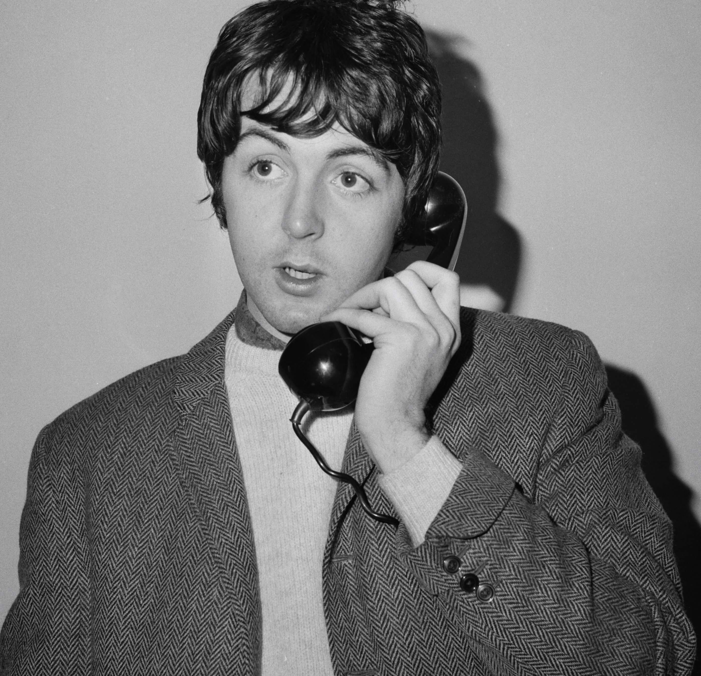 Paul McCartney with a phone