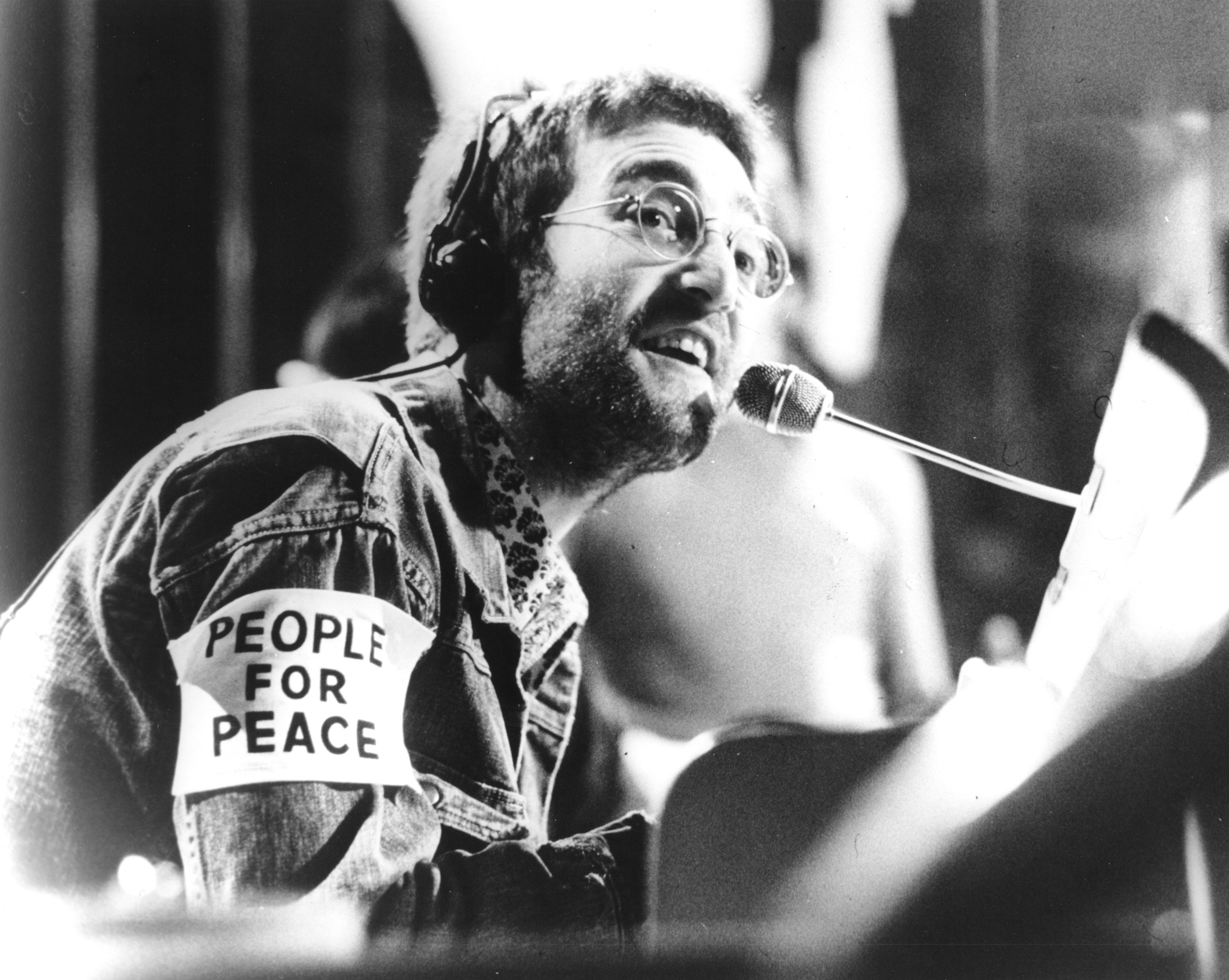 John Lennon at a piano during his Plastic Ono Band era