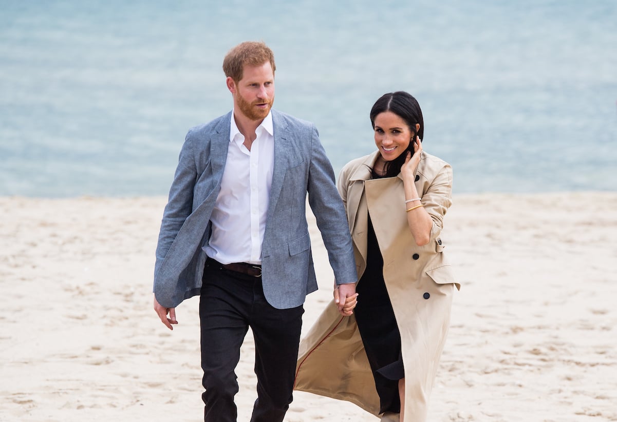 Prince Harry and Meghan Markle on the beach in New Zealand in 2018