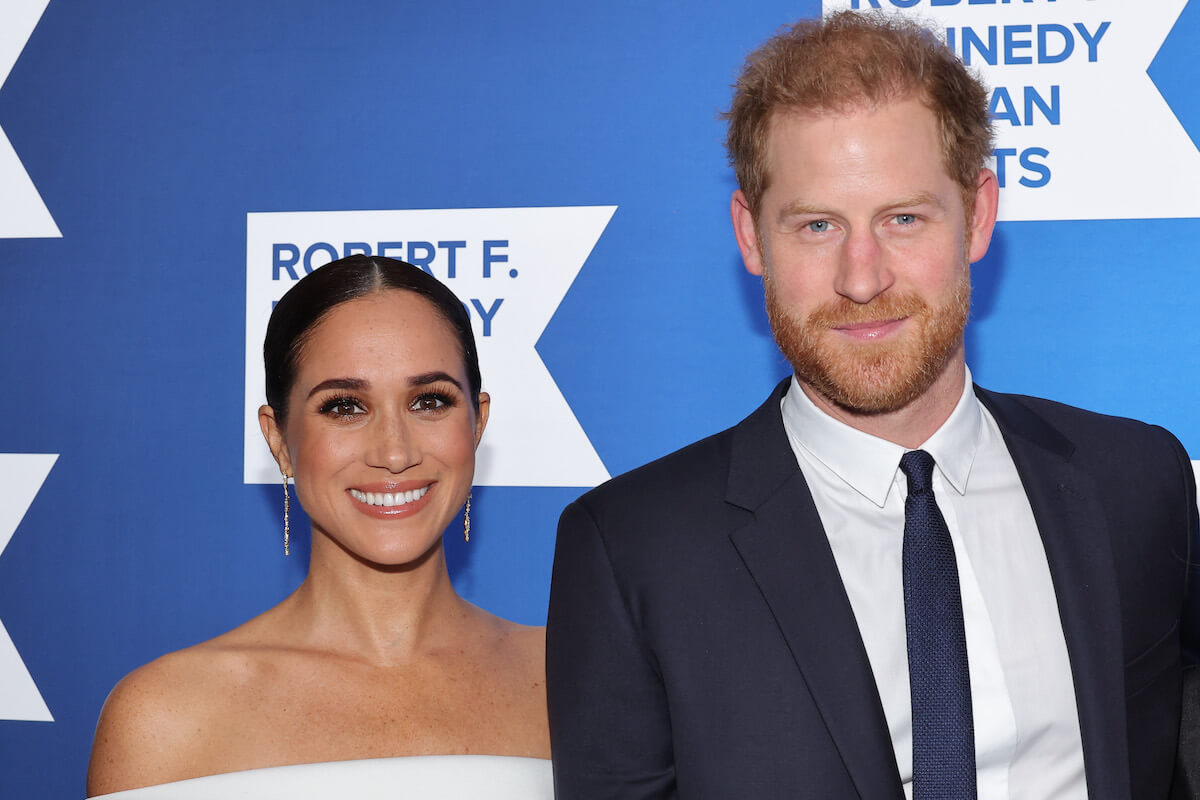 Prince Harry, who could have a royal family reconciliation only without Meghan Markle, according to an expert, stands with Meghan Markle