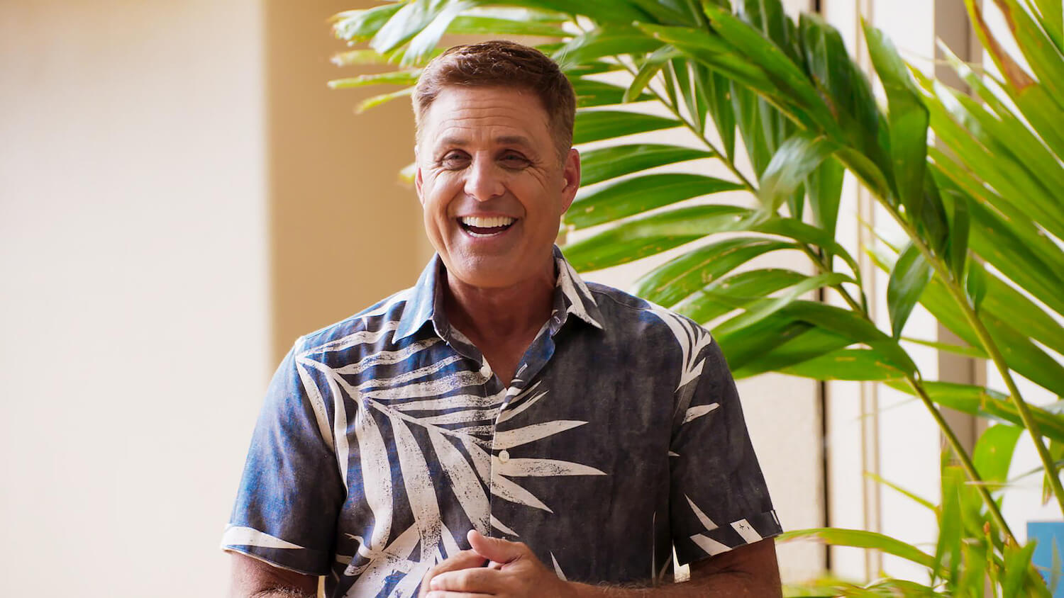 'Temptation Island' Season 5 host Mark L. Walberg smiling 