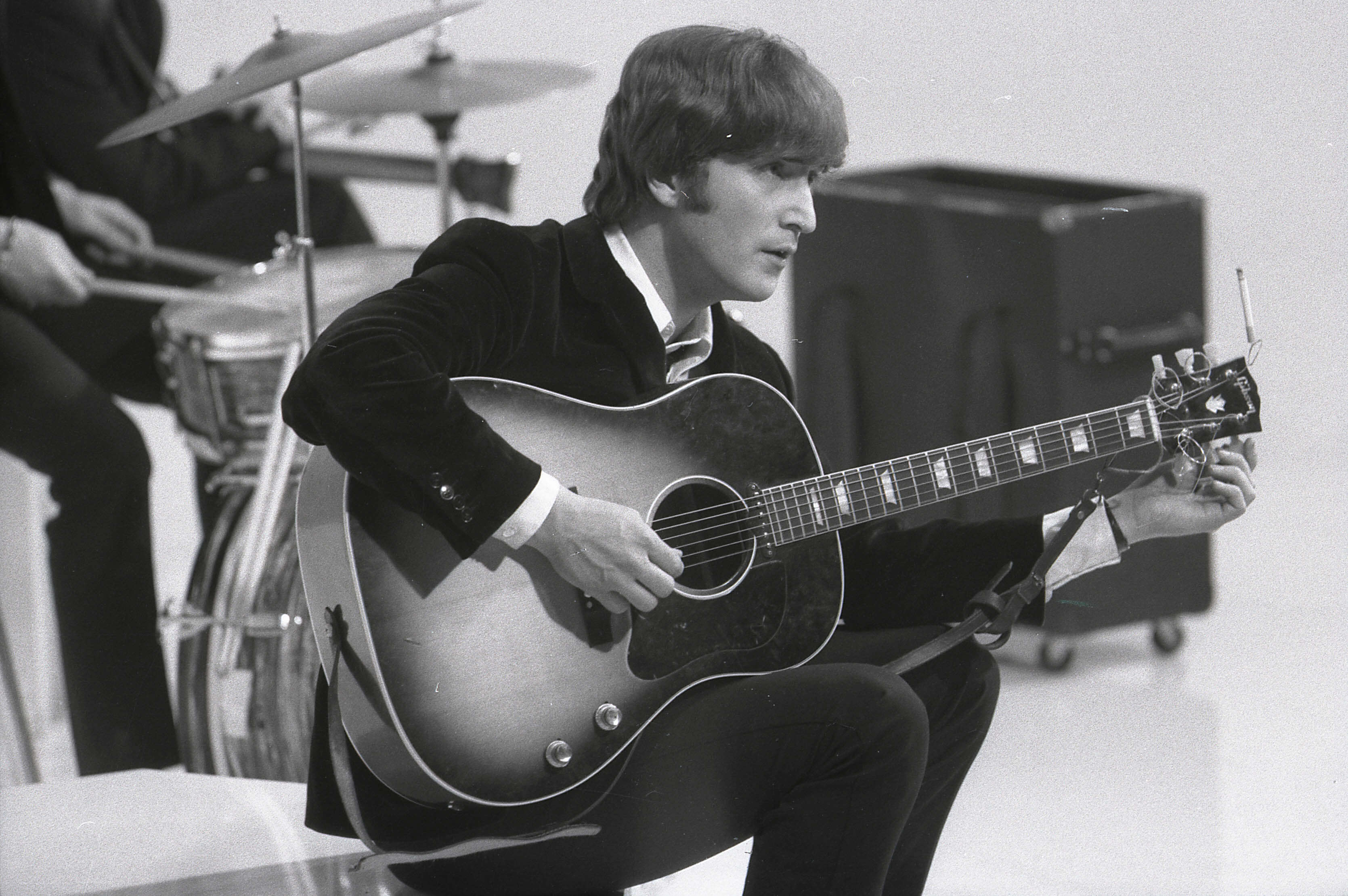 John Lennon with a guitar during The Beatles' 'Dear Prudence" era