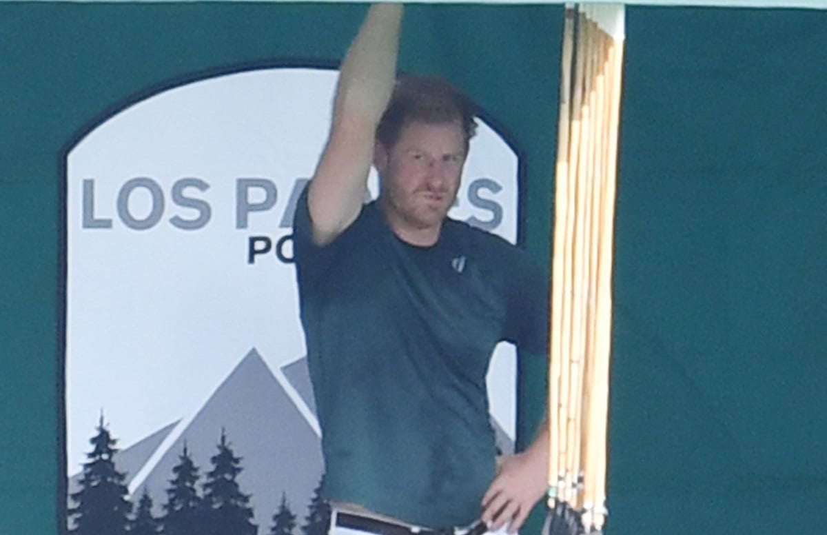 Prince Harry, who a commentator says is 'trying so hard' to look happy in U.S. even though no one cares about his title, at polo club in Santa Barbara, California