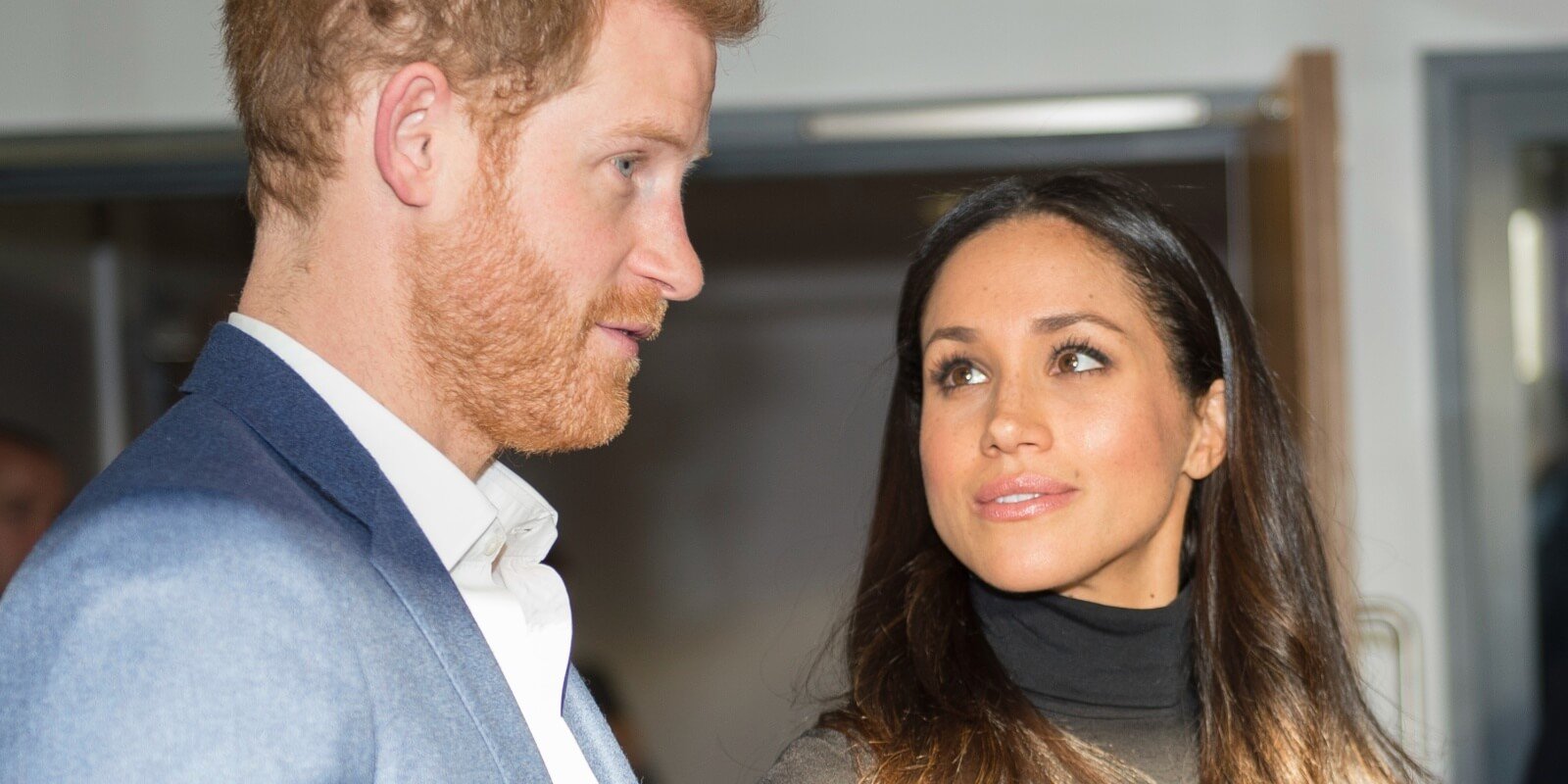 Meghan Markle looks at Prince Harry during a visit to Nottingham Academy on December 1, 2017.