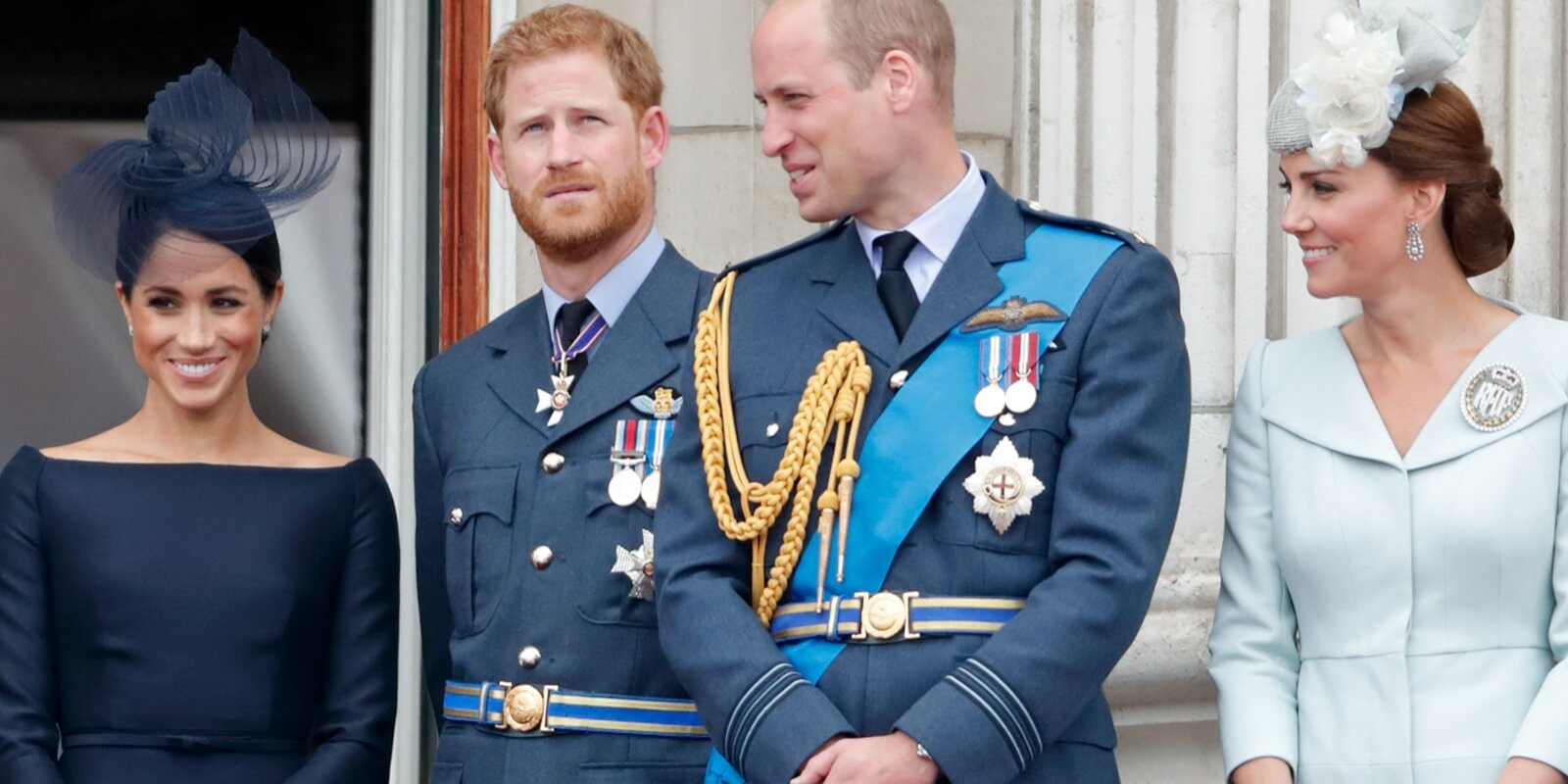 Meghan Markle, Prince Harry, Prince William and Kate Middleton stand together on the Buckingham Palace balcony in London, England.