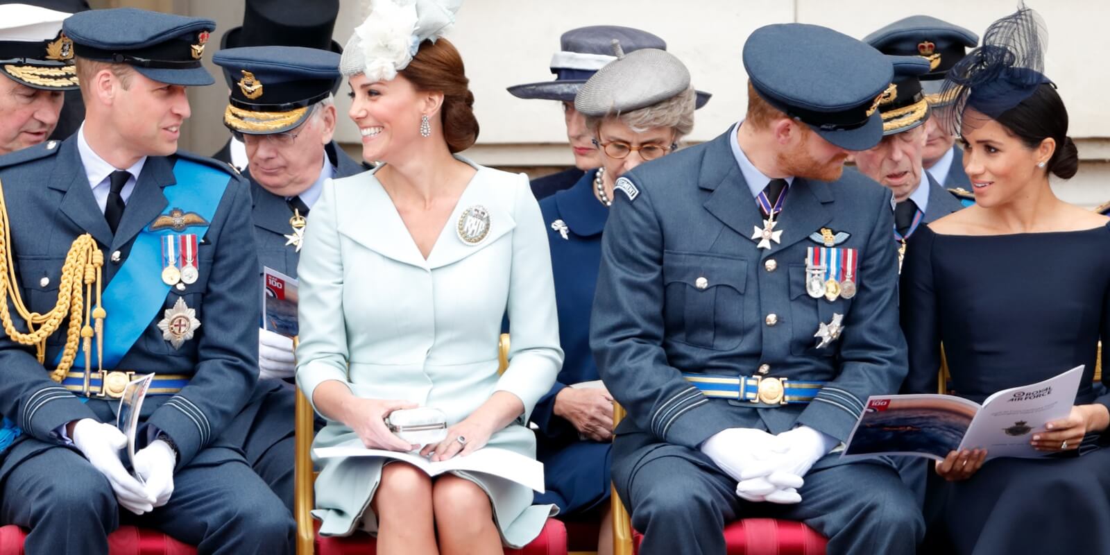 Prince William, Kate Middleton, Prince Harry and Meghan Markle mark the centenary of the Royal Air Force on the forecourt of Buckingham Palace on July 10, 2018 in London, England.