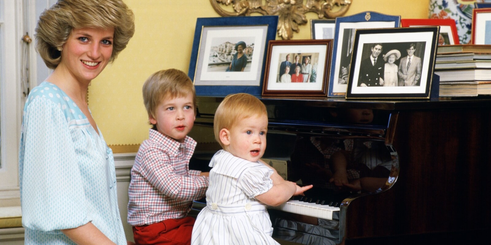 Princess Diana, Prince William and Prince Harry at the piano in Kensington Palace.