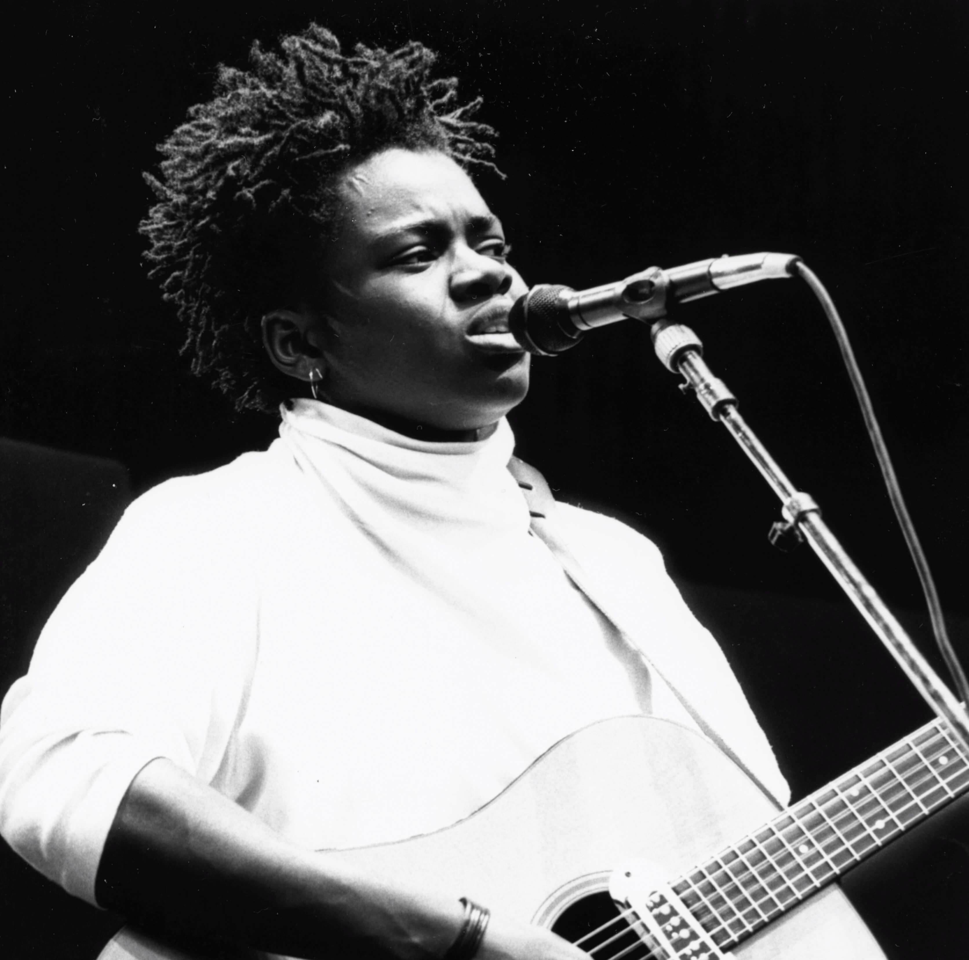 "Fast Car" singer Tracy Chapman with a microphone