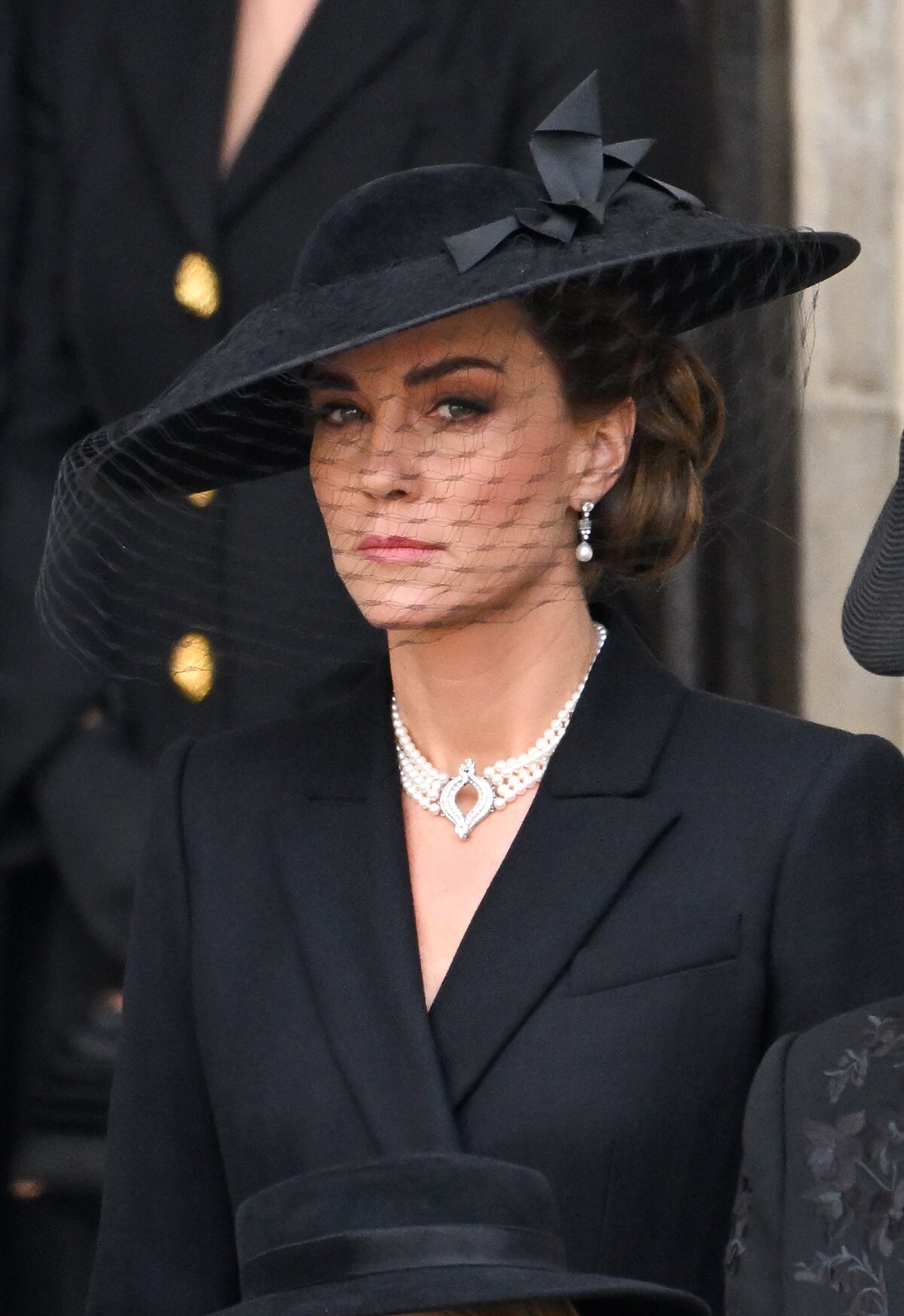 Kate Middleton wearing pearl chocker and earrings during the State Funeral of Queen Elizabeth II