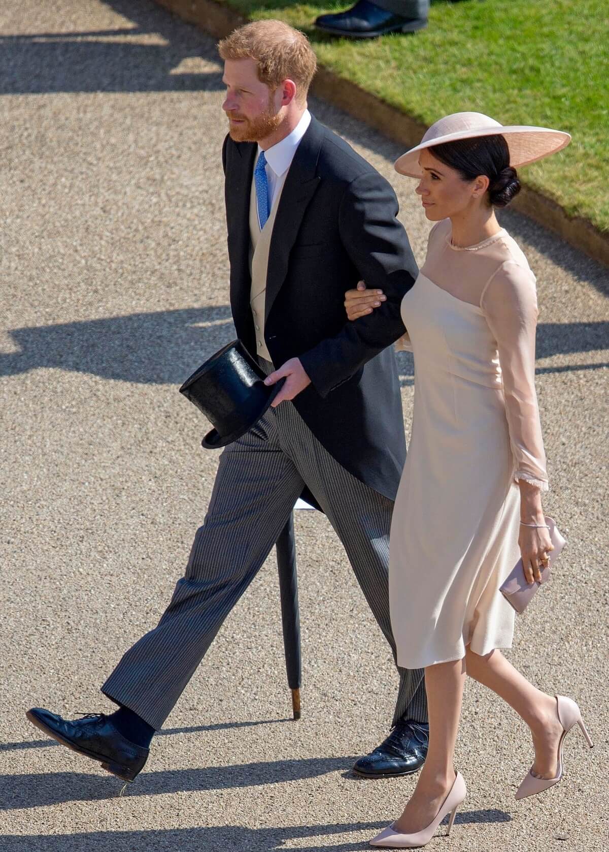 Prince Harry and Meghan Markle arrive to then-Prince Charles' 70th birthday garden party at Buckingham Palace 