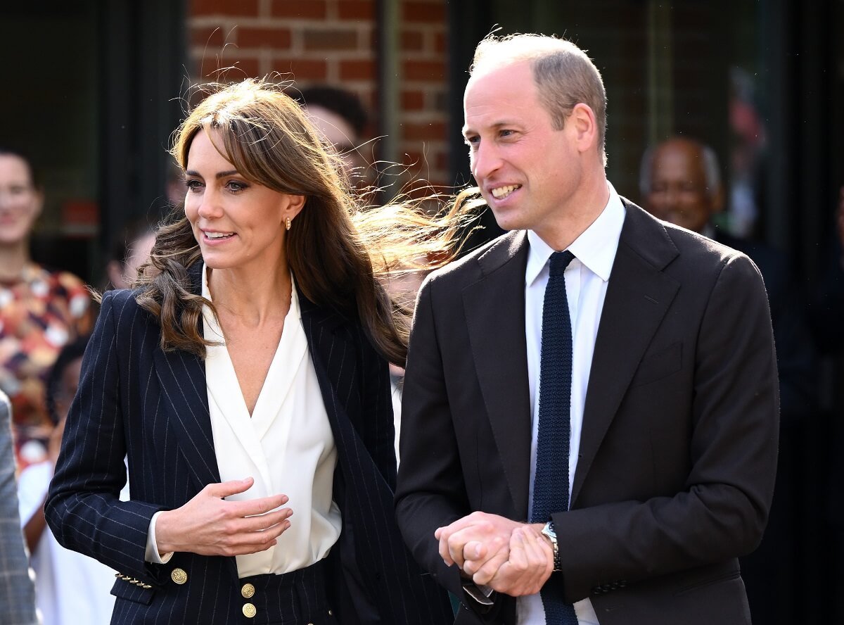 Kate Middleton and Prince William, who an expert warns need to appear together during their outings, visit the Grange Pavilion together in Cardiff Wales