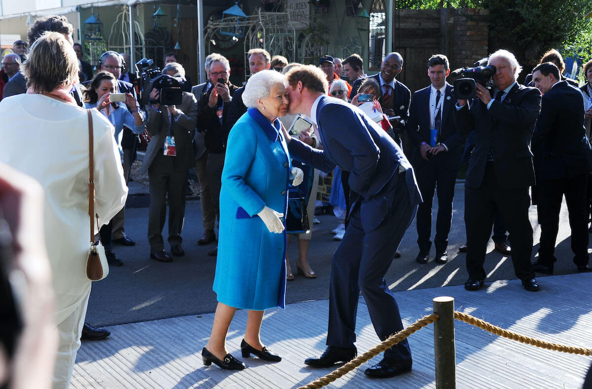 Prince Harry kisses Queen Elizabeth on the cheek in 2015