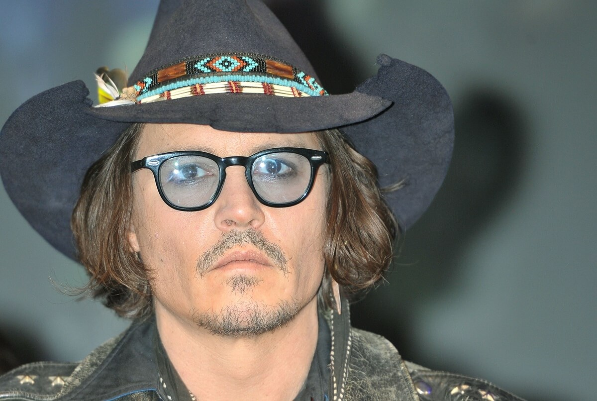 Johnny Depp at the 'Dark Shadows' press conference wearing a hat.
