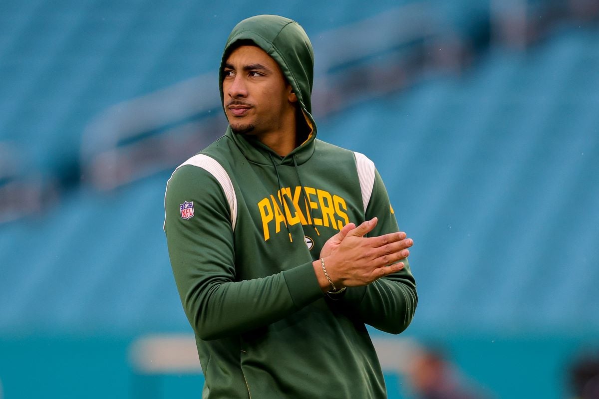 Jordan Love, whose father was African-American while his mother is white, warms up prior to a game against the Miami Dolphins