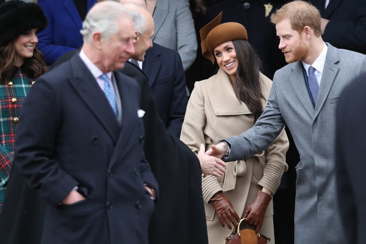 Prince Harry and Meghan Markle with King Charles