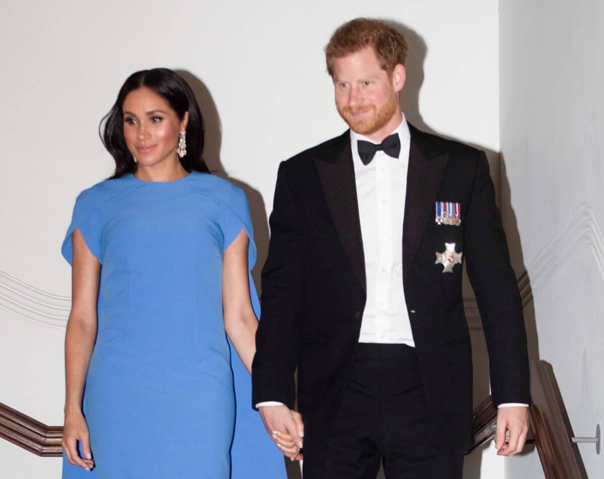 Prince Harry and Meghan Markle attend a state dinner hosted by the president of the South Pacific nation Jioji Konrote