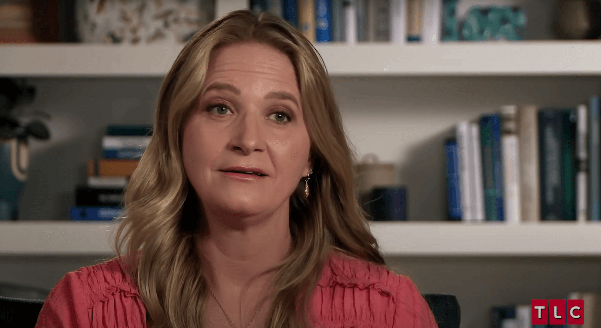 Christine Brown, in front of a bookshelf, in an episode of 'Sister Wives'