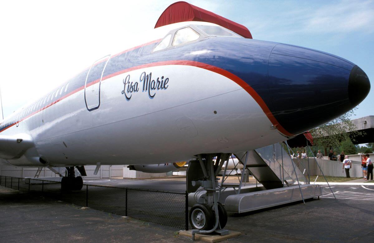 The front of Elvis Presley's private plane, the Lisa Marie. It is blue, red, and white.